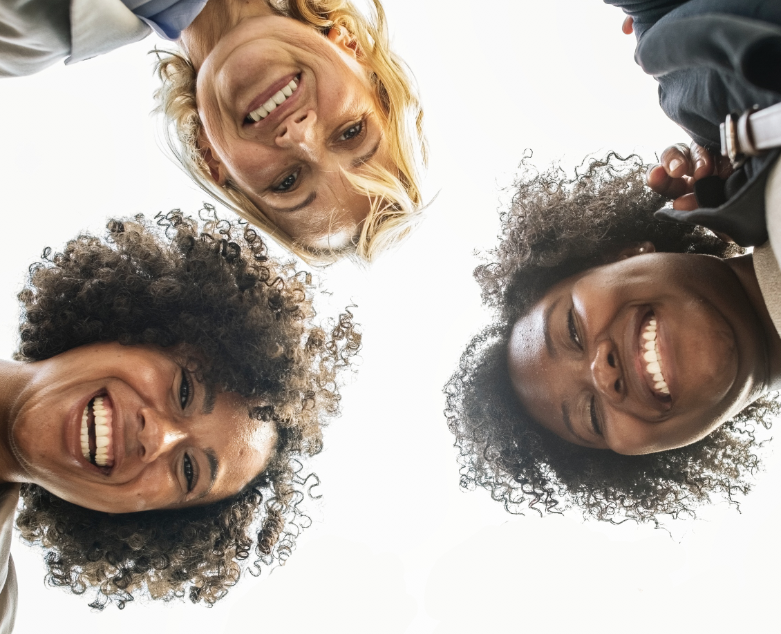 three teachers smiling