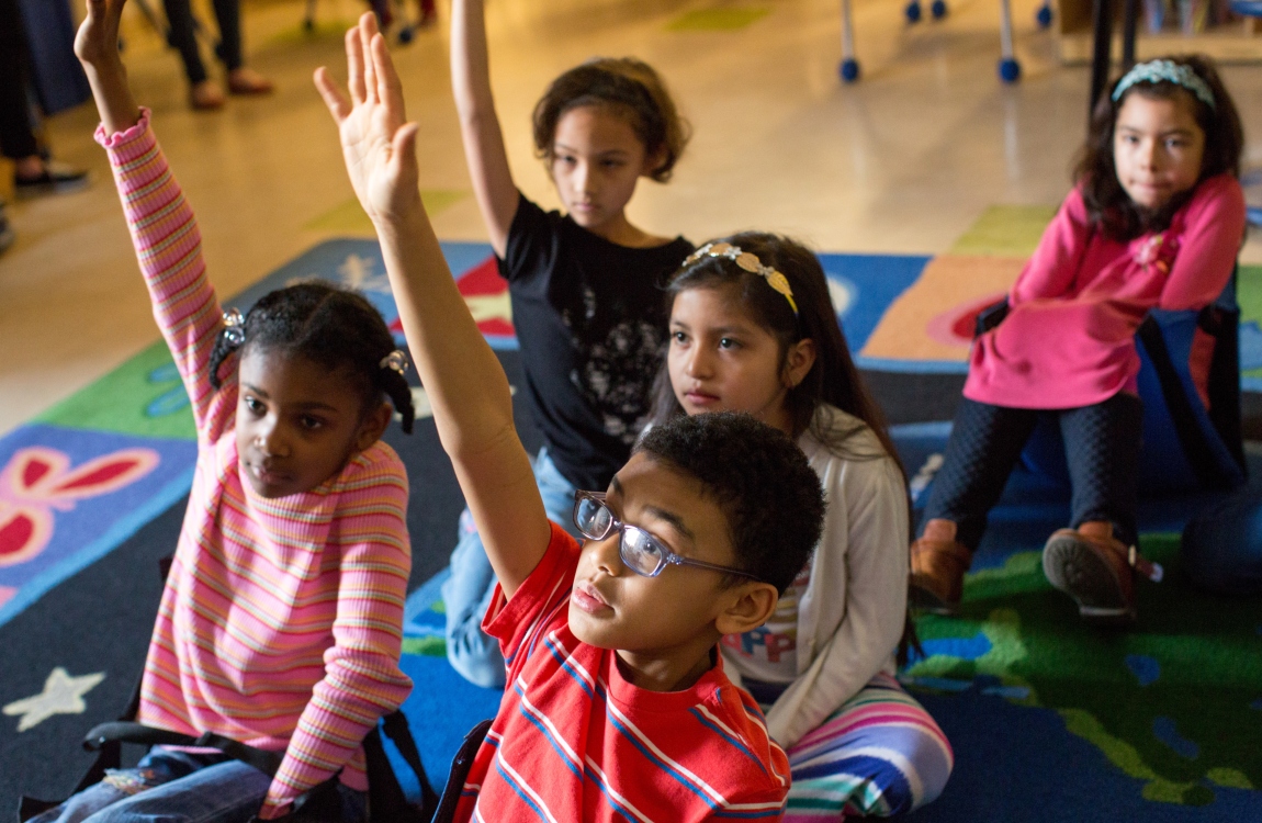 Students raising their hands 