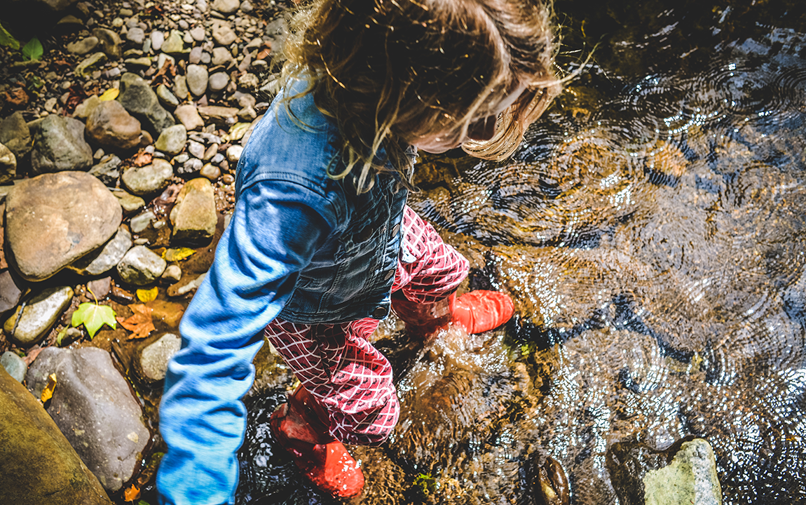 girl walking in the stream