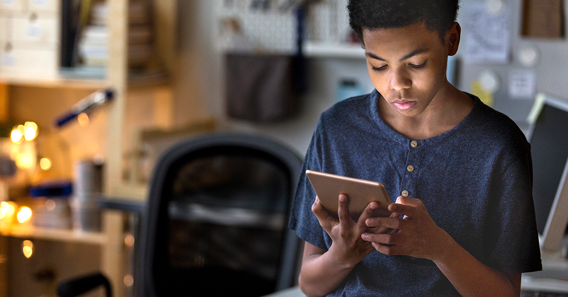 student doing homework on a tablet