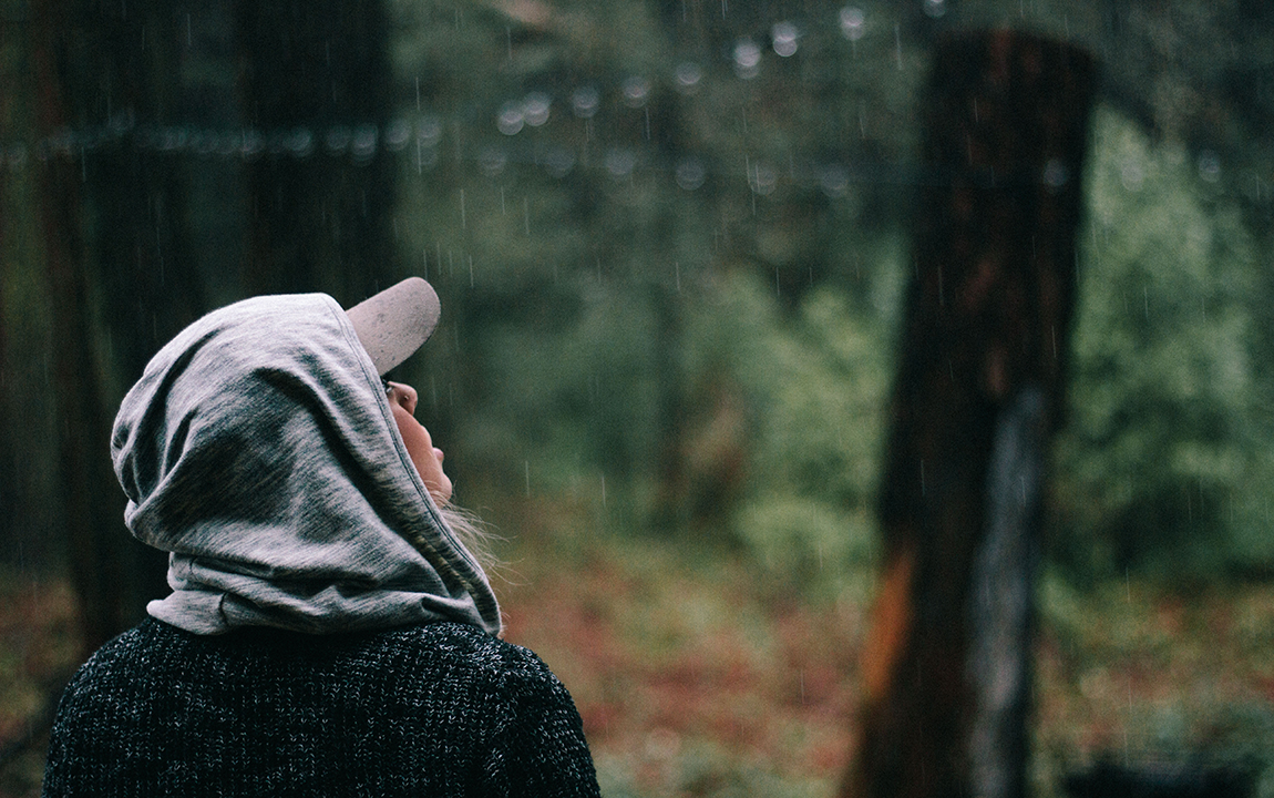 woman looking at rain
