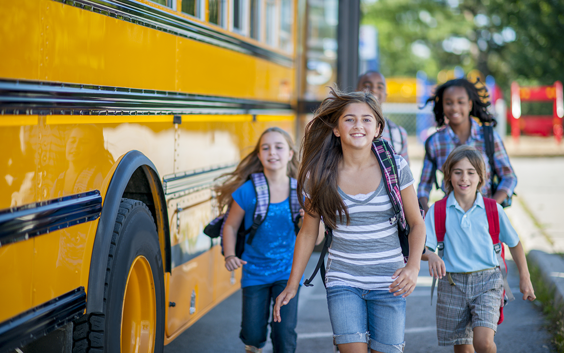 kids next to a school bus