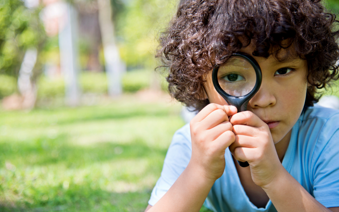 boy with a magnifier 