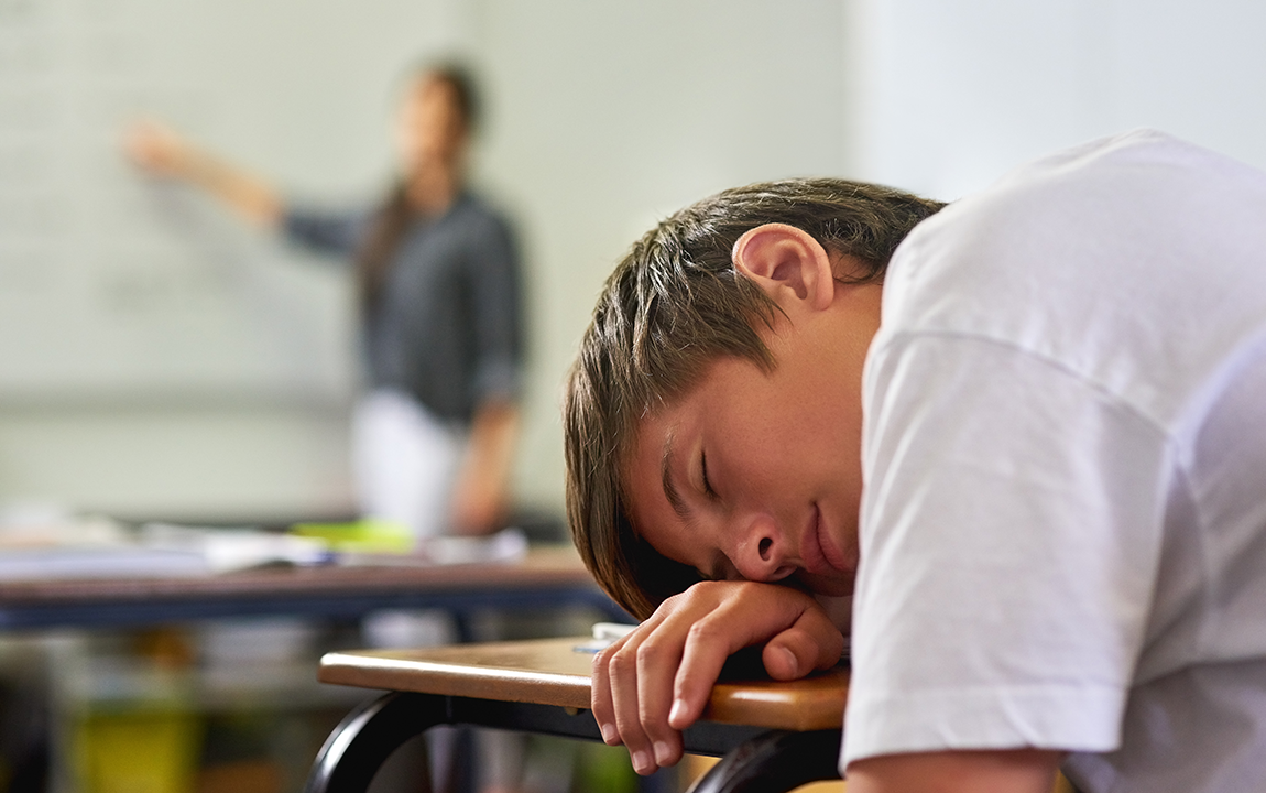 student asleep at desk