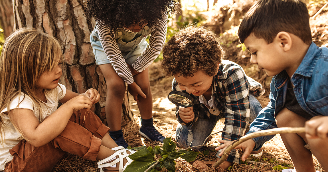 children in nature working on a PBL project