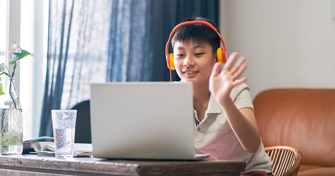 student listening at computer