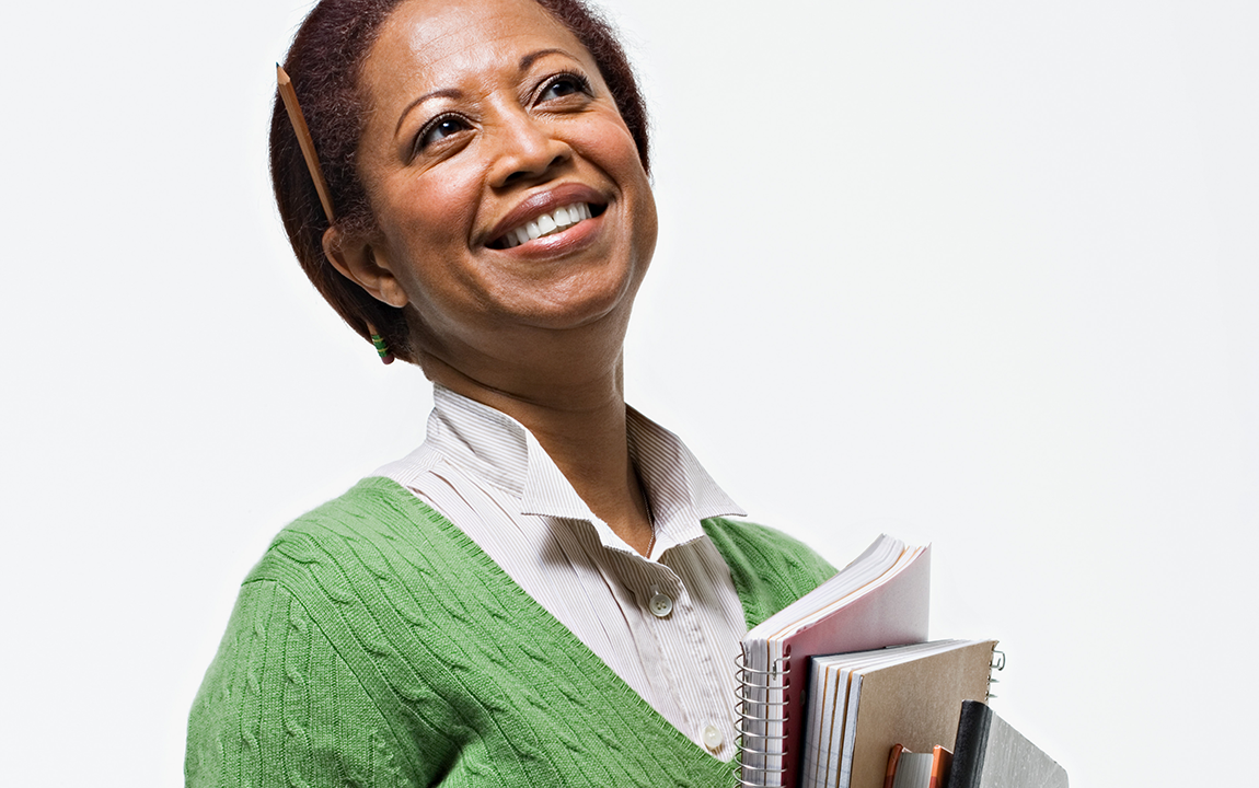 teacher with notebooks