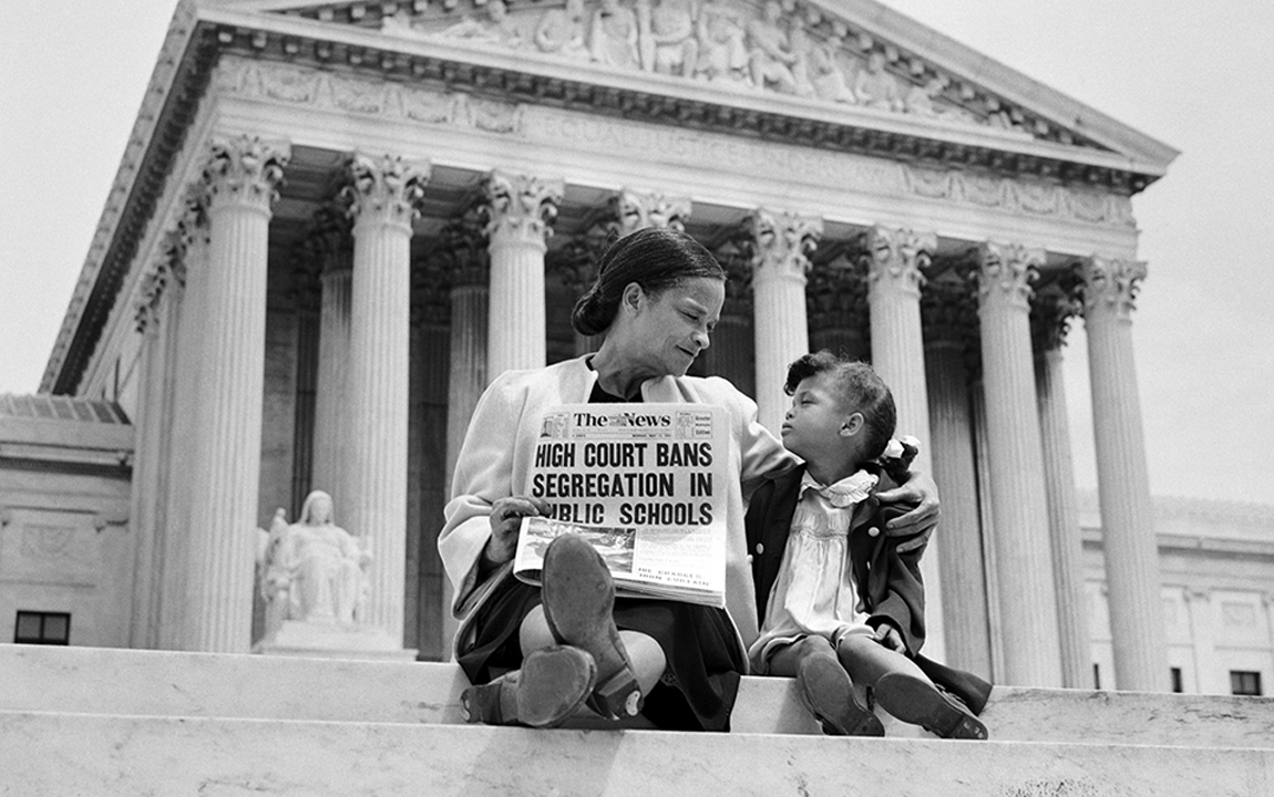 Nettie Hunt and her daughter Nickie sit on steps of the US Supreme Court building on May 18, 1954, the day following the Court's historic decision in Brown v. Board of Education