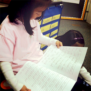 a young female student reading