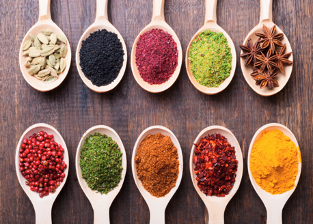 rows of spoons with different spices