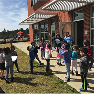 Group of students working on project outside