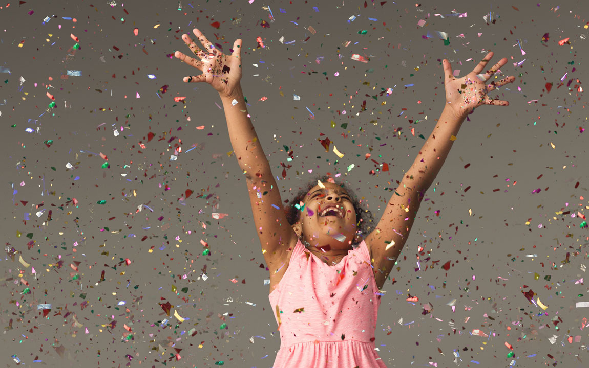child with confetti
