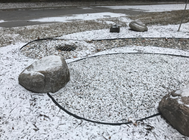 This is part of the serenity garden at Parkview Elementary School. Wood chips wash into the storm drain. In the spring, we will plant native plants along the edging to prevent the erosion.