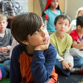 young child thinking in class