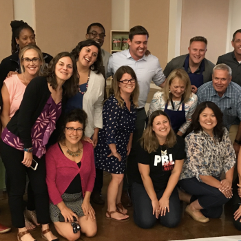 group of staff members smiling