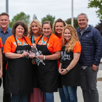 Group of PBL teachers wearing aprons from a PBL workshop activity