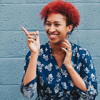 woman smiling and pointing