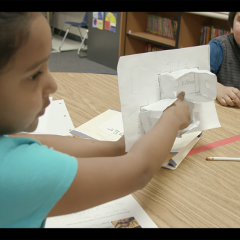 female student showing work in a PBL classroom