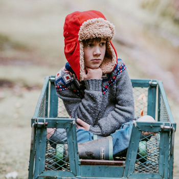 A young boy thinking/reflecting 