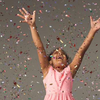 child with confetti