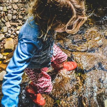 girl walking in the stream