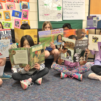 kids in a PBL classroom reading 