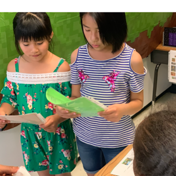 Students presenting a math project 