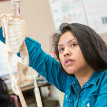 student with their hand raised