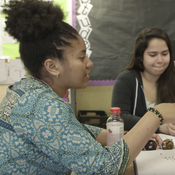 Two female students in a discussion