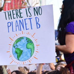 sign that says "there is no planet B" - carried by students in a protest march