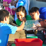 three young student working on their garden PBL project