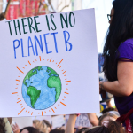 sign that says "there is no planet B" - carried by students in a protest march