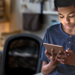 student doing homework on a tablet