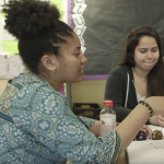 Two female students in a discussion